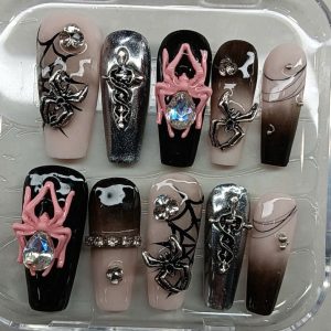 Long coffin gothic press-on nails featuring 3D pink spiders, silver snake charms, and black spiderwebs by Pro Nails